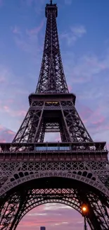 Eiffel Tower with a vibrant dusk sky in the background, capturing the iconic Paris scene.