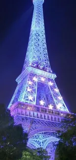 Illuminated Eiffel Tower at night with vibrant blue hues against the night sky.