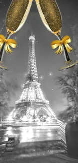 Eiffel Tower with champagne glasses at night.