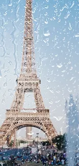 Wallpaper of the Eiffel Tower with raindrop overlay under a bright blue sky.