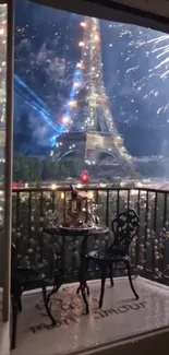 Eiffel Tower with fireworks viewed from a balcony in Paris.