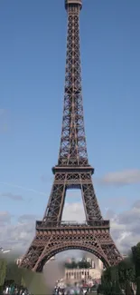 Eiffel Tower under a clear blue sky in Paris, ideal mobile wallpaper.