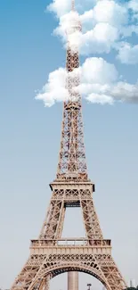 Eiffel Tower under a clear blue sky with water fountains in the foreground.