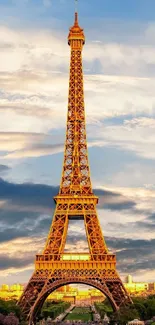 Eiffel Tower basked in golden light under a vibrant sky.