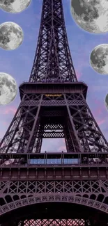 Wallpaper of Eiffel Tower with moons in a vibrant sky.