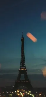 Eiffel Tower illuminated with fireworks at night.