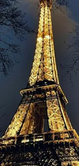 Illuminated Eiffel Tower against night sky, perfect for mobile wallpaper.