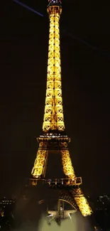 Eiffel Tower glowing at night, Paris.