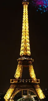 Eiffel Tower illuminated at night on a mobile wallpaper.