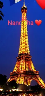 Eiffel Tower illuminated at night with deep blue sky backdrop.