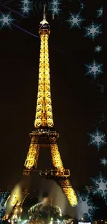 Eiffel Tower lit up at night with snowflake designs surrounding it.