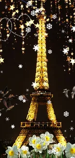 Illuminated Eiffel Tower with stars and flowers at night.