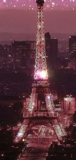 Eiffel Tower illuminated at night with pink city lights.