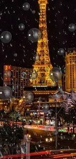 Eiffel Tower illuminated against a night sky in Paris, with city lights and traffic below.