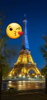 Eiffel Tower night view with a kiss emoji and vibrant lights.