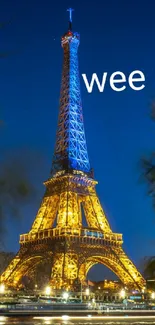 Eiffel Tower illuminated at night with blue sky backdrop.