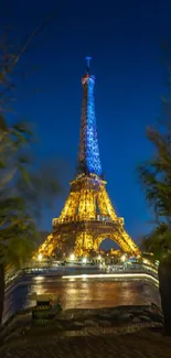 Eiffel Tower illuminated at night in Paris.