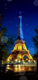 Eiffel Tower illuminated at night with vibrant lights.