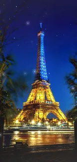 Eiffel Tower illuminated against a deep blue night sky.