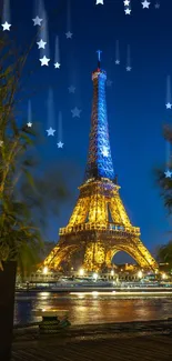 Eiffel Tower illuminated at night with blue and golden lights, framed by trees.