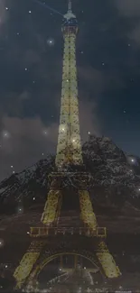 Eiffel Tower against a starry night sky with mountainous silhouette.