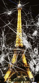 Illuminated Eiffel Tower at night, shining against the dark Paris sky.