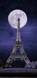 Eiffel Tower under a full moon and starry night.