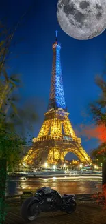 Eiffel Tower under full moon with motorcycle in forefront.