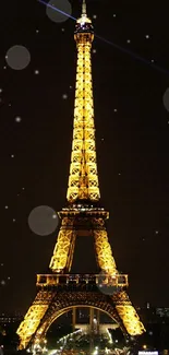 Illuminated Eiffel Tower at night in Paris.