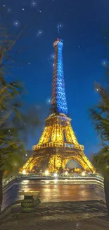 Eiffel Tower illuminated at night with vibrant blue skies.