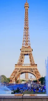 Eiffel Tower against blue sky with fountains in Paris.