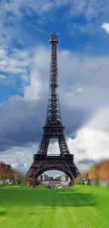 Eiffel Tower with blue sky and green park wallpaper.