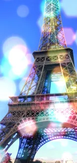 Eiffel Tower against a bright blue sky and green trees.