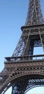 Eiffel Tower against a blue sky, perfect for mobile wallpaper.