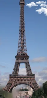 Eiffel Tower under a blue sky with clouds in Paris.