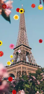 Eiffel Tower under a blue sky with spring flowers.