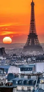 Eiffel Tower silhouetted by a vibrant orange sunset in Paris.