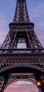 Eiffel Tower against a purple sunset sky, ideal for mobile wallpaper.