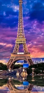 Eiffel Tower reflected on water against a vibrant sunset sky.