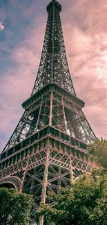 Majestic view of the Eiffel Tower at sunset with vibrant skies.