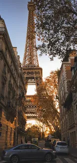 Eiffel Tower at sunset between Parisian streets.