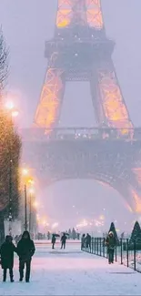 Winter scene at Eiffel Tower with snow and glowing lights.