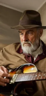 Elderly man with a hat plays guitar, showcasing wisdom and passion.