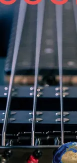 Close-up of electric bass guitar with strings and blue background.