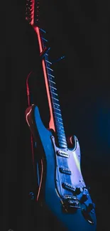 Electric guitar with vibrant lighting on dark background.