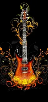 Electric guitar with fiery orange floral design on black background.