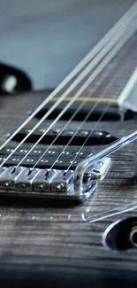 Closeup of an electric guitar with strings and frets in focus.