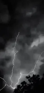 Lightning striking through cloudy night sky.