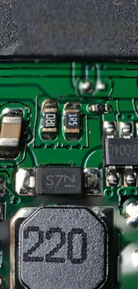 Close-up view of green electronic circuit board with components.