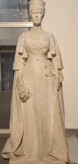 Statue of a queen in elegant stone attire.